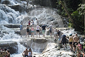 People climbing up Dunn`s River Falls, Jamaica