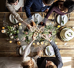 People Cling Wine Glasses on Wedding Reception with Bride and Groom