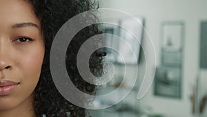 People close up half face portrait of multi racial curly model with closed eyes