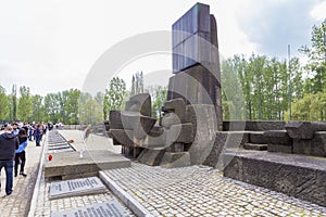 People commemorating at Pomnik w Birkenau monument