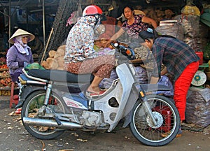 People are communicating on street market in Hue, Vietnam