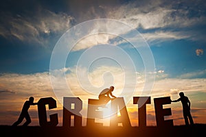 People connect letters to compose the CREATE word. Creativity, making art, teamwork photo