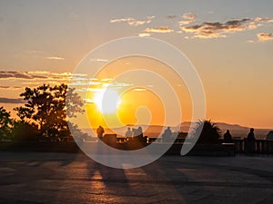 People contemplate the sunrise on the summit of Mount-Royal, Montreal, Quebec, Canada