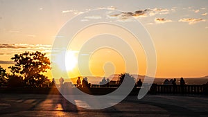 People contemplate the sunrise on the summit of Mount-Royal, Montreal, Quebec, Canada