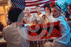 People in costumes  celebrating Halloween Party