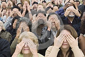People Covering Eyes With Hands photo