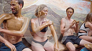 People Covering Their Bodies With Mud At A Spa