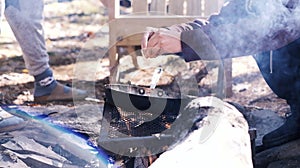 People cracking eggs over a pan