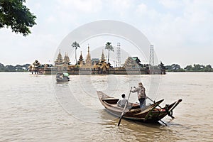 people cross yangon river by boat for pray at Ye Le Paya pagoda the floating pagoda on small island