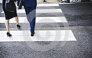 People crossing a city road