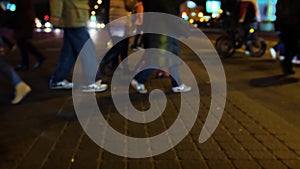 People crossing crosswalk in city. new york city night lights background