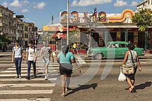 People crossing pedestrian crosswalk Vedado Havana