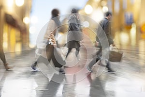 People crossing street on rainy day