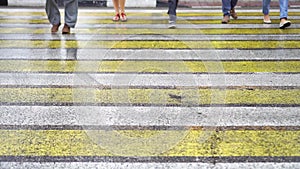 People crossing the street on a zebra in the city