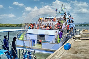 People on Crowded Ferry awaiting Disembarking