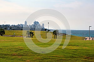 People cycle, jog and relax in the Midron Yaffo seafront park, a popular place for recreation among locals and tourists