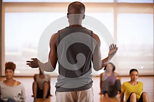 People, dancer and instructor with class of students in fitness, workout or pilates at the studio. Rear view of personal