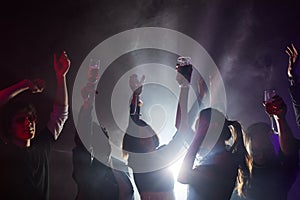 People Dancing in Club Backlit