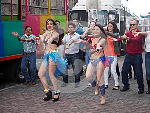 People dancing Macarena on the street, Quito, Ecuador.