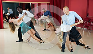 People dancing samba in pairs photo