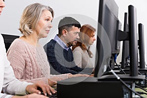 People of different ages learning to use computers