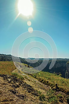 People on dirt pathway at the Itaimbezinho Canyon