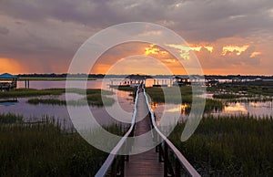 People on dock at sunset