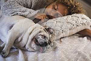 People and dog in relax sleeping indoor leisure activity at home. One female puppy pet owner asleep with her best friend forever