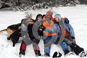 People and dogs in snow