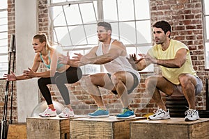 People doing plyo box exercise