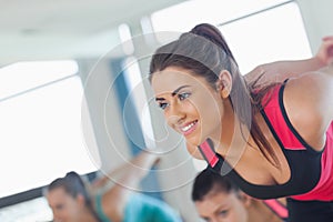 People doing power fitness exercise at yoga class