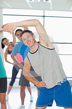 People doing power fitness exercise at yoga class