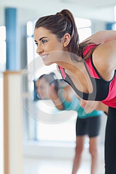 People doing power fitness exercise at yoga class