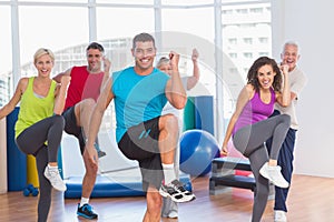 People doing power fitness exercise at yoga class