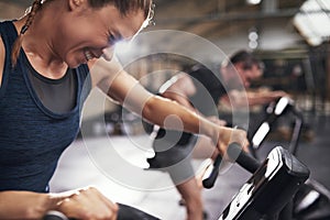 People doing trainig on exercycle in gym