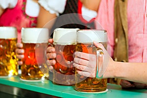 People drinking beer in Bavarian pub