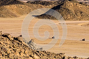 People driving quad bikes during safari trip in Arabian desert not far from the Hurghada city, Egypt