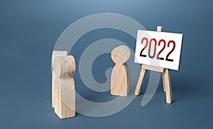 People and easel 2022 year. Summing up, analytics and forecasting. New plans for next year. Report presentation. Summarizing.