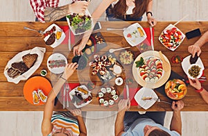 People eat healthy meals at festive table dinner party