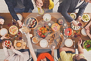 People eat healthy meals at served table dinner party