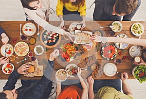 People eat healthy meals at served table dinner party