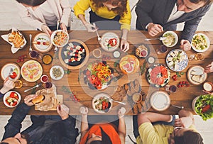 People eat healthy meals at served table dinner party