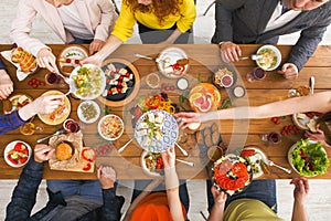 People eat healthy meals at served table dinner party