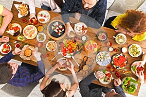 People eat healthy meals at served table dinner party