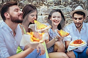 People eating fast food in city while travelling