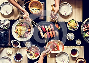 People eating Japanese food together