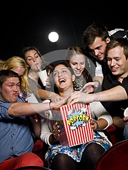 People eating popcorn