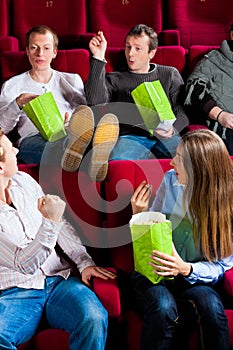 People eating popcorn in theatre