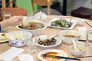 People eating Szechuan Chinese food