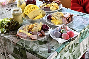 People eating traditional easter food with salad, ham eggs, beetroot and horseradish